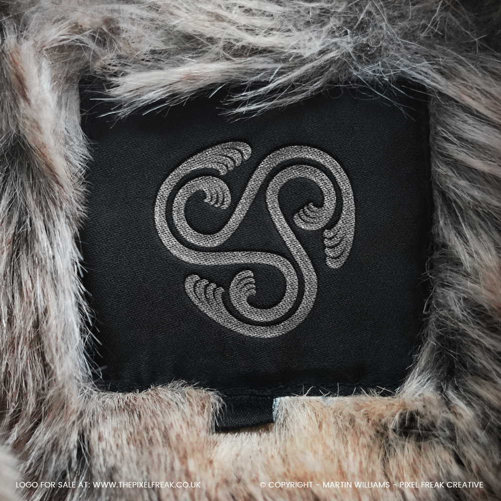 Abstract wave brand mark on clothing label