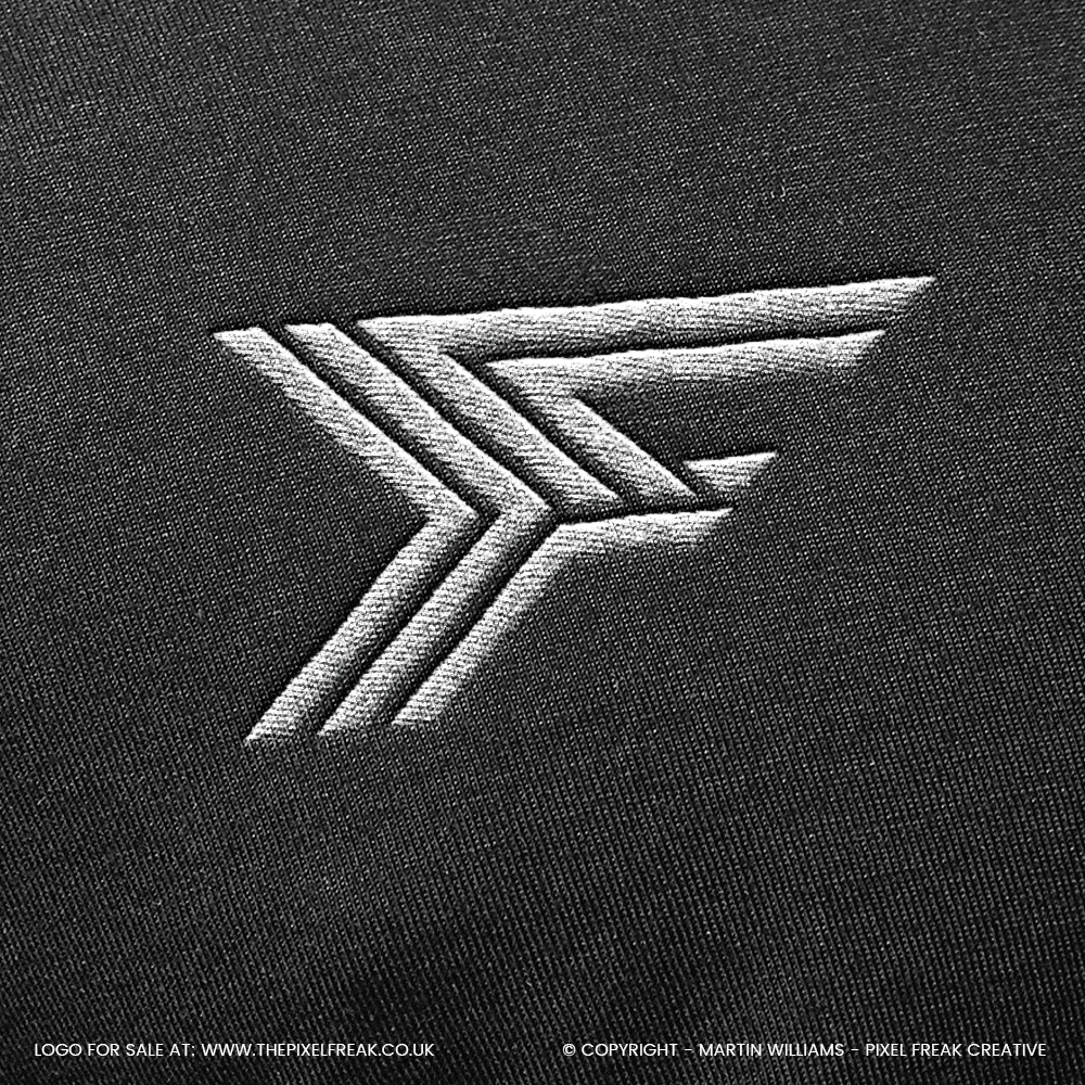 Embroidered F brand mark on fabric, ideal for motorsport apparel