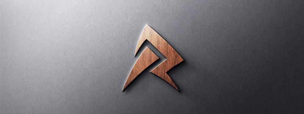 The 'R' monogram logo design shown as a 3D wood effect emblem.