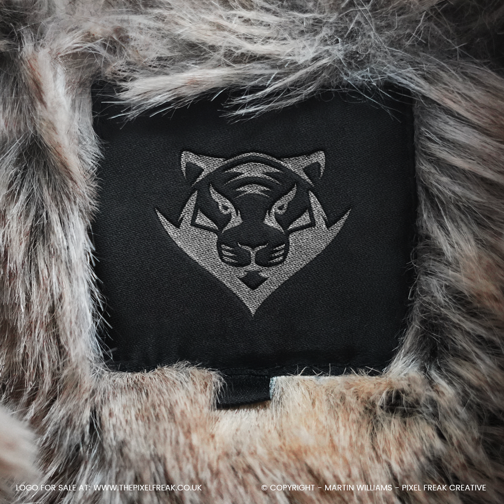 embroidered tiger logo design on a clothing label